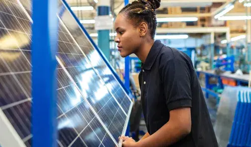 Woman looking at solar panel