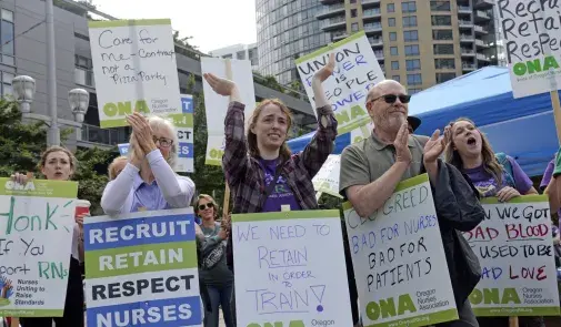 Photo of OSHU nurses and supporters on strike with signs.