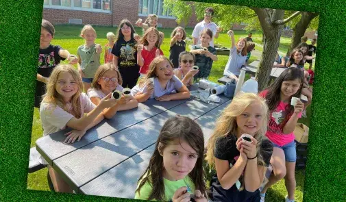 Photo of students during a hands-on lesson about planting seeds.