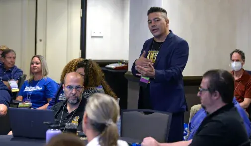 Photo of participant speaking at the 'Take Back Your Profession: Elevating Educator Voice in Education Policy (Education Civil Rights Alliance)' workshop