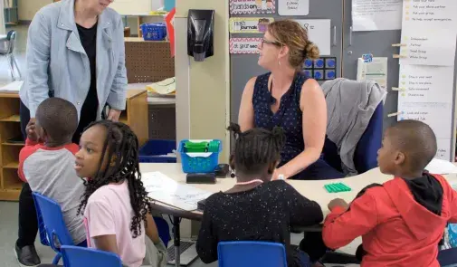 Photo of AFT President Randi Weingarten, left, visiting educators and students at Makowski Early Childhood Center in Buffalo, N.Y., on June 2, 2022.