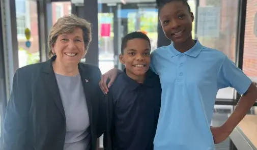 AFT President Randi Weingarten with two students