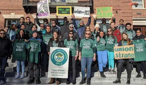 group of union members pose for picture