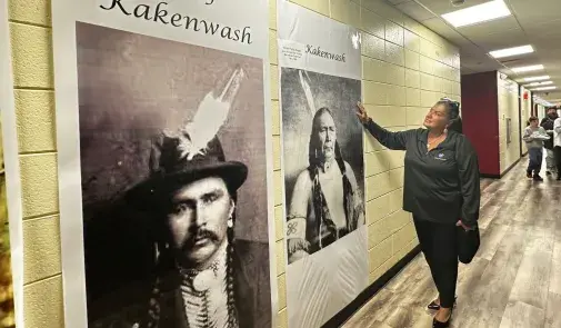  AFT Executive Vice President Evelyn DeJesus admires posters of Chief Kakenwash.