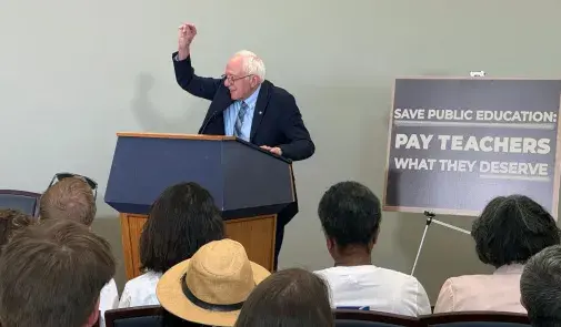 Senator Bernie Sanders at a podium