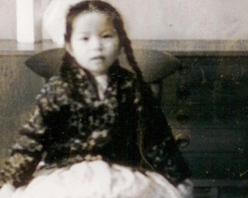 Black and white image of Tracy Lai as a child