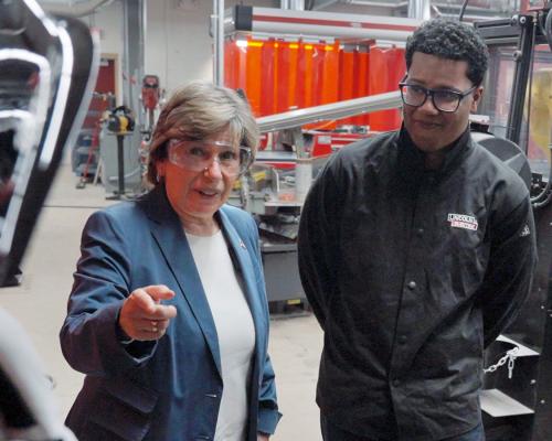 Weingarten, left, with students at Corcoran High School in Syracuse, NY, on Oct. 16, 2023.