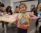 kid holding book