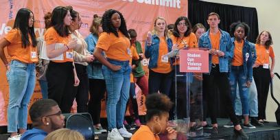 Mei-Ling Ho-Shing stands onstage with a group of young activists at the 2018 Student Gun Violence Summit