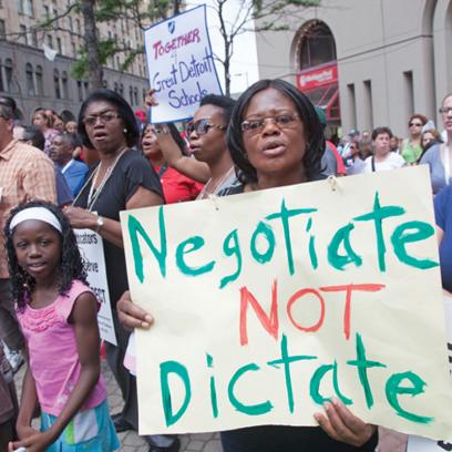 a rally with signs reading "Together 4 Great Detroit Schools" and "Negotiate Not Dictate"