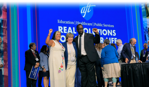 Photo shows AFT President Randi Weingarten, Secretary-Treasurer Fedrick C. Ingram, and Executive Vice-President Evelyn DeJesus, and others together on stage at AFT Convention 2024